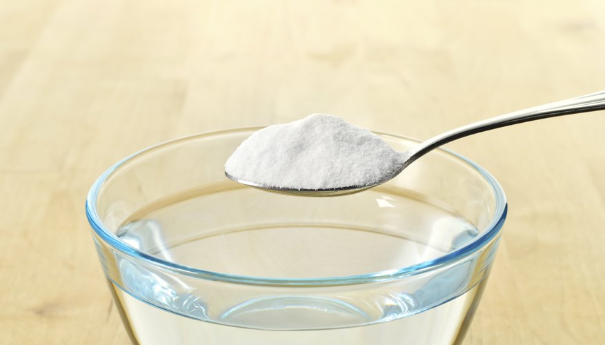 Baking soda being mixed with water. Baking soda being mixed with water.
