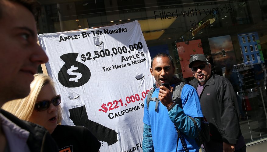 Activists Call For Apple To Pay Taxes On Money Held Overseas