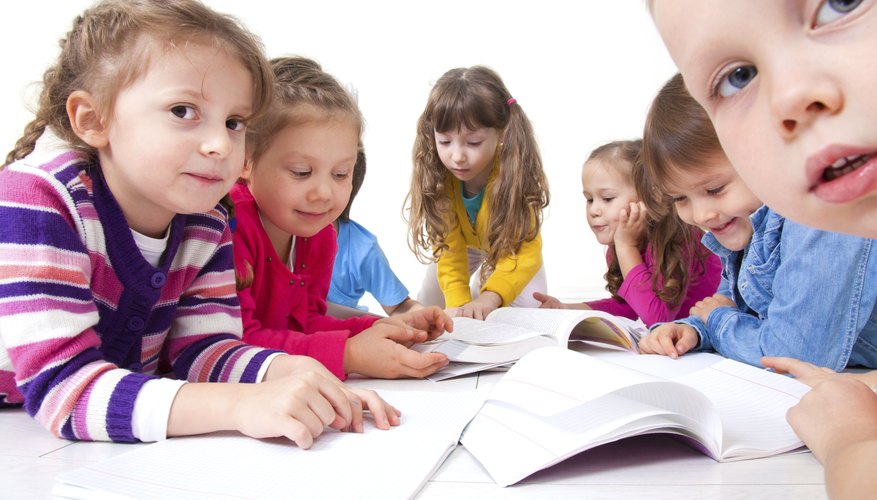 A group of children reading together A group of children reading together