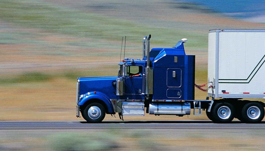 Cab of truck with passing scenery