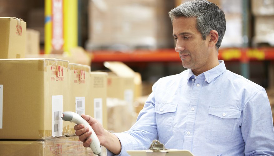 Worker Scanning Package In Warehouse