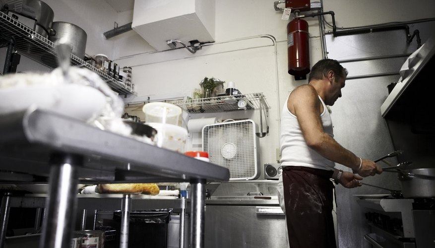Chef preparing meal in restaurant kitchen