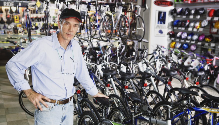 Portrait of man standing in bike shop