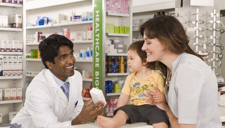 Mother and son with pharmacist