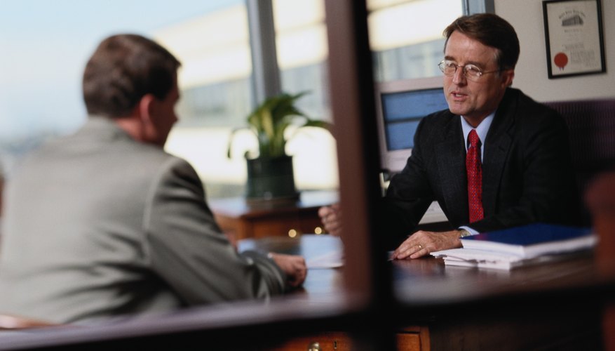 Two brokers are in a meeting.