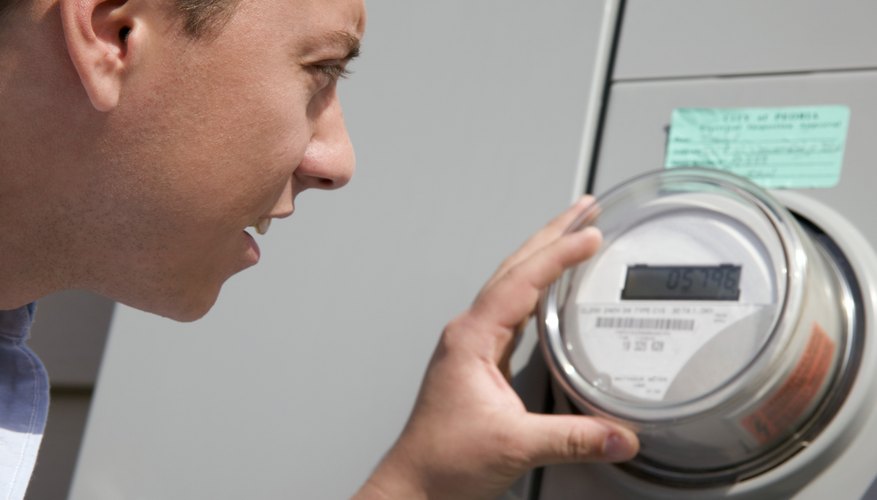 Man reading power meter