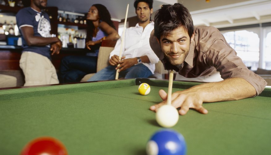 Young man playing pool