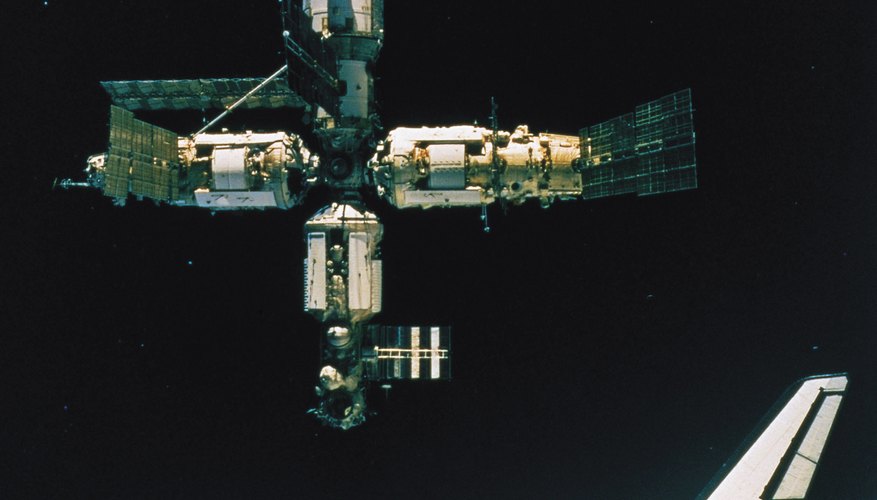 Photo Credit: Comstock Images/Stockbyte/Getty Images Space shuttles carried many experiments to the International Space Station.