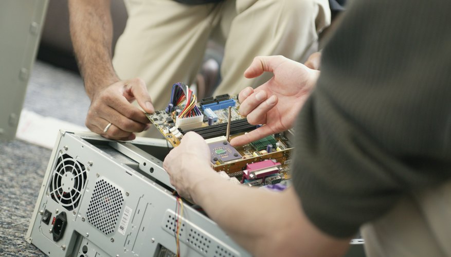 How To Start A Home Computer Repair Business Bizfluent Technicians Working On A Computer Starting Home Repair Business Not Only Allows You