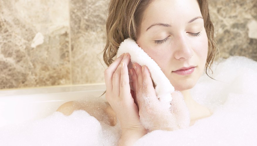 Woman with washcloth on ear Woman with washcloth on ear