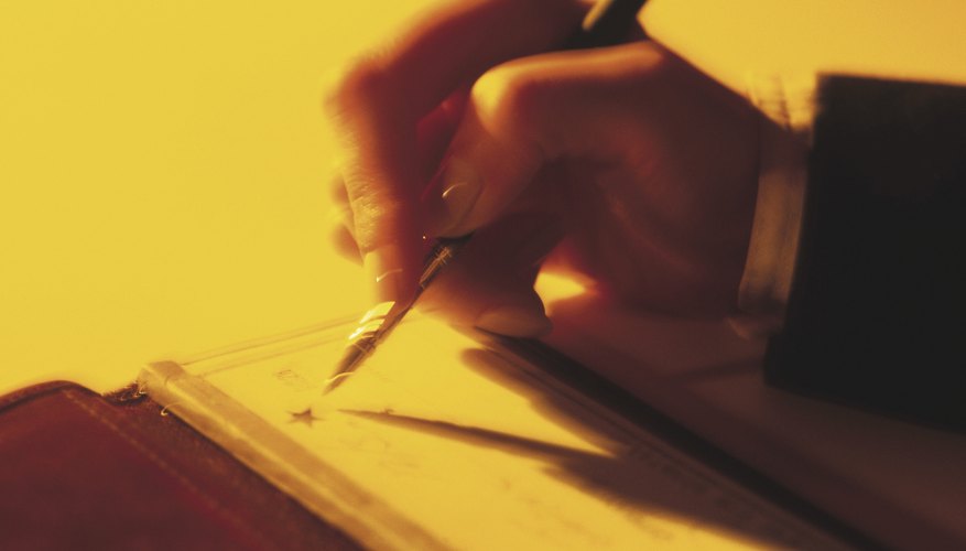 Businessman writing checks