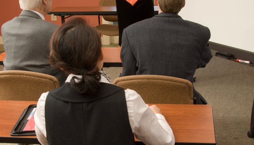 Photo Credit: Jupiterimages/Photos.com/Getty Images Formal training helps employees understand diversity issues.