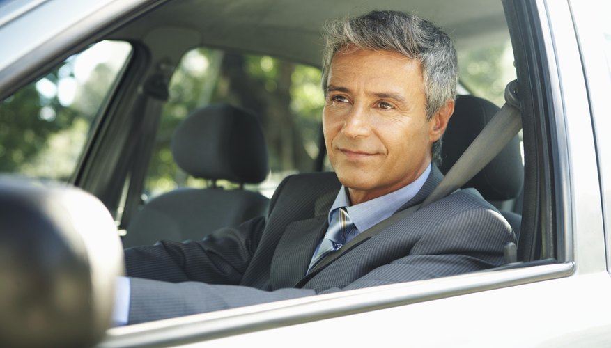 Businessman in car, close up