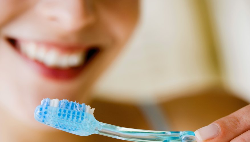 Woman brushing her teeth Woman brushing her teeth