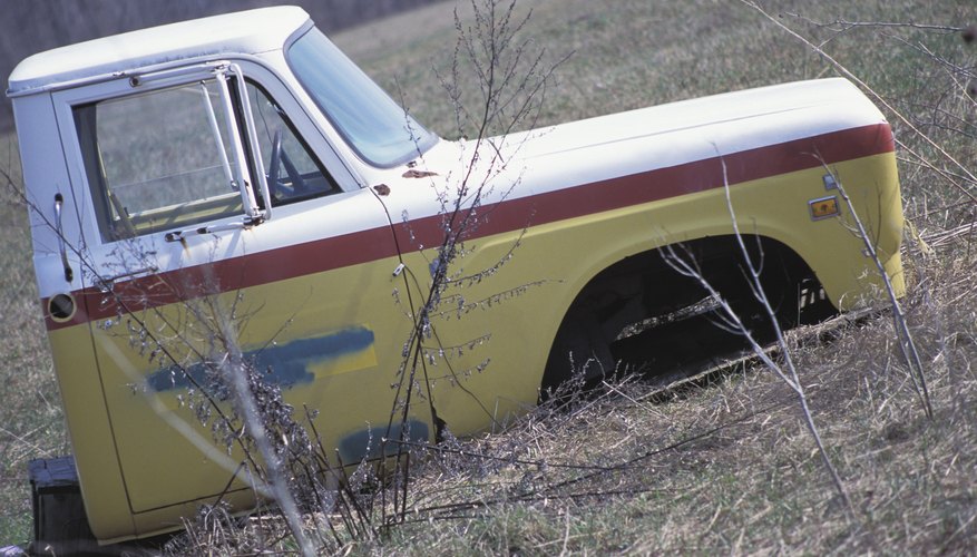 Abandoned truck in field