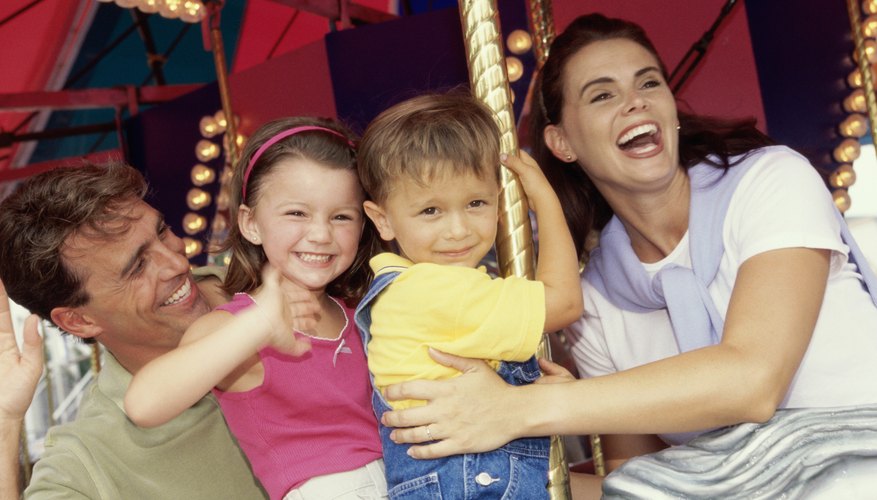 Photo Credit: Purestock/Purestock/Getty Images A family on a ride at a fair.