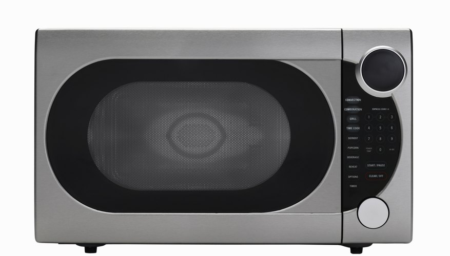 Stainless steel microwave oven on white