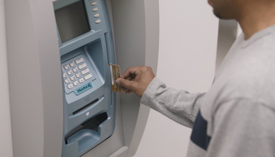 Man using an automatic teller machine.