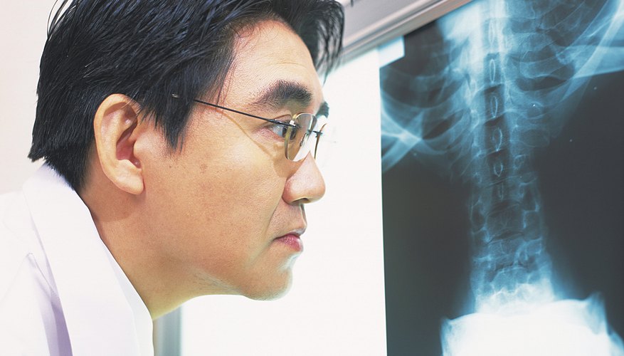Photo Credit: DAJ/amana images/Getty Images Looking at an x-ray.