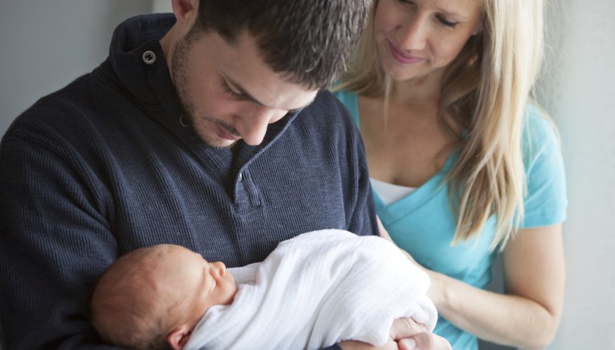 Couple holding their newborn baby. Couple holding their newborn baby.