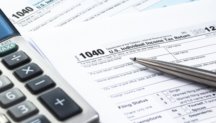 Photo Credit: Drazen_/iStock/Getty Images Tax forms