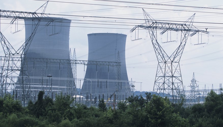 Photo Credit: Tom Brakefield/Stockbyte/Getty Images Nuclear power plants deliver energy through a shared electrical grid.