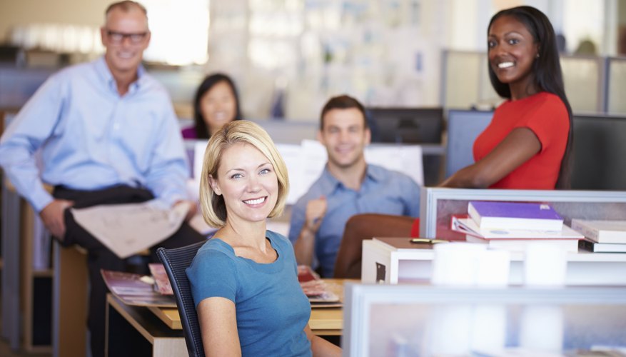 Portrait Of Businesspeople In Modern Open Plan Office