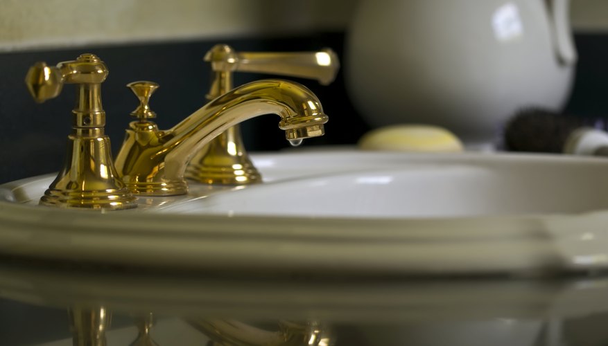 A brass bathroom faucet. A brass bathroom faucet.