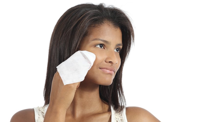 Woman wipes skin Woman wipes skin