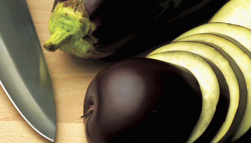 Eggplant on cutting board Eggplant on cutting board