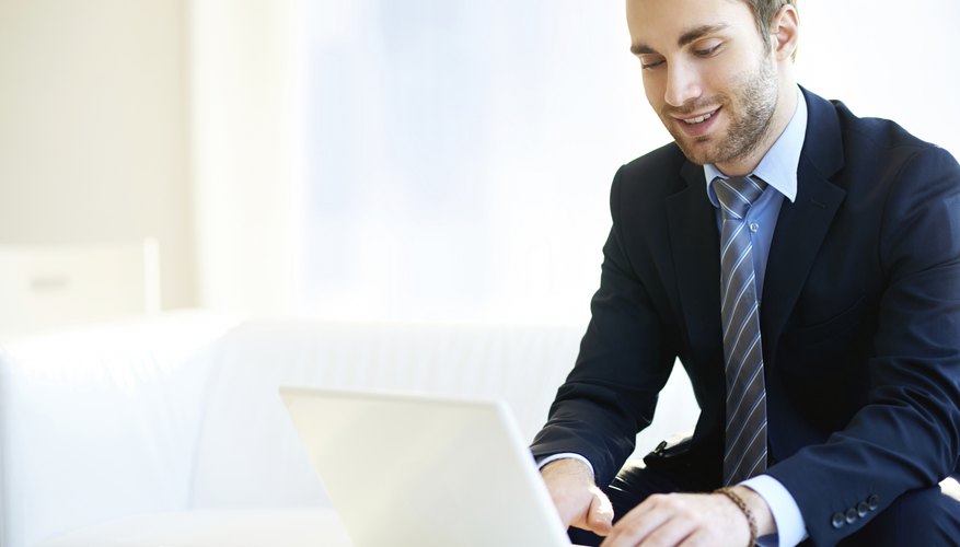 Photo Credit: shironosov/iStock/Getty Images Man running online business