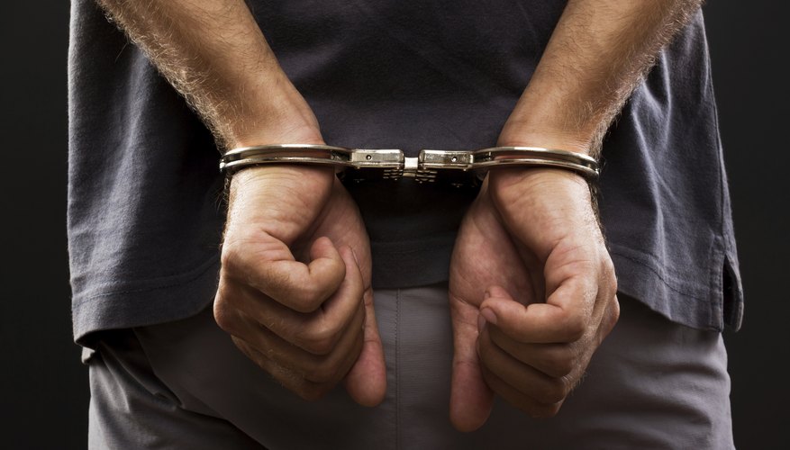 Photo Credit: jinga80/iStock/Getty Images Man in handcuffs