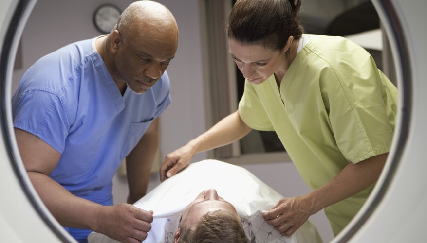 Nurses preparing patient for scan Nurses preparing patient for scan