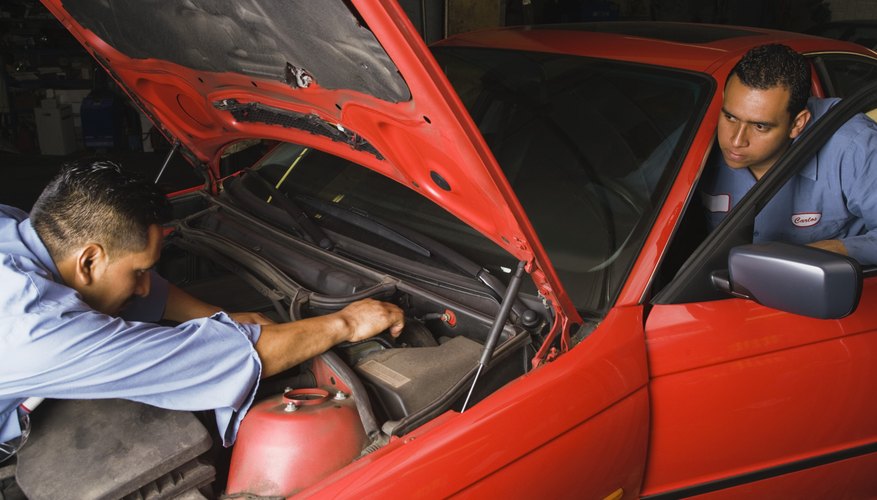 Mechanics fixing car