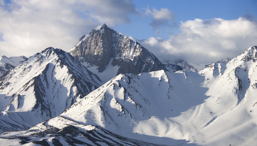 The atmospheric pressure is lower in the mountains than at sea level. The atmospheric pressure is lower in the mountains than at sea level.