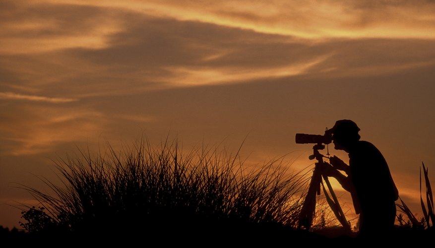 Silhouette of a photographer taking a snapshot of the sunset