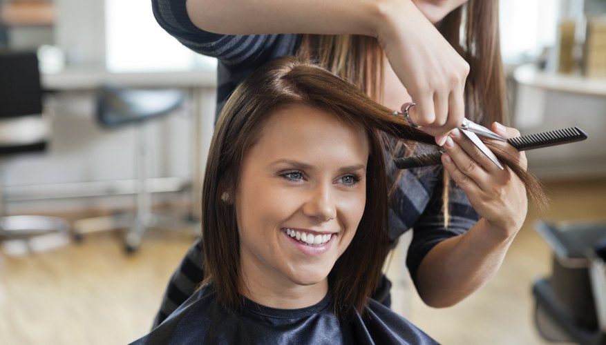 Photo Credit: tyler olson/iStock/Getty Images woman getting a haircut in salon