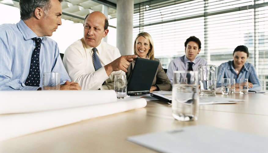 Line of Business Executives Sitting at a Boardroom Table