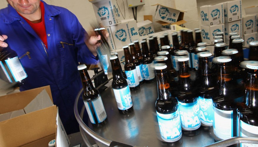 Photo Credit: Jeff J Mitchell/Getty Images News/Getty Images Beer bottles being packaged