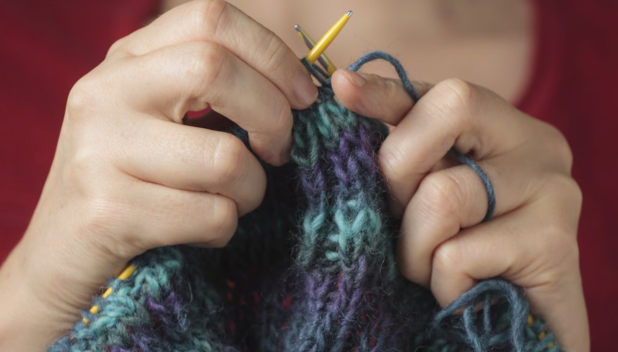 Photo Credit: mkallstrom/iStock/Getty Images Woman knitting