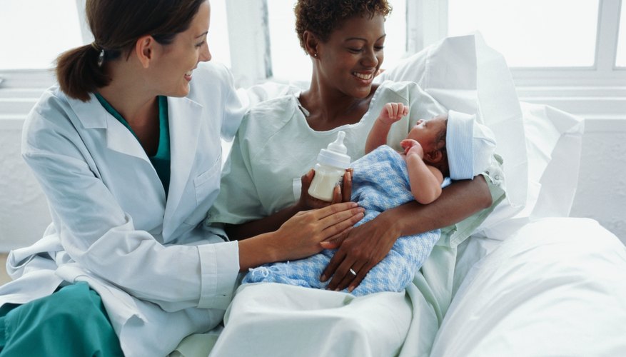 Photo Credit: Stockbyte/Stockbyte/Getty Images nurse newborn