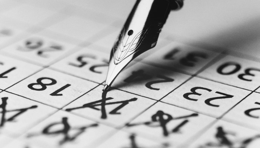 Pen Marking the Days on a Calendar
