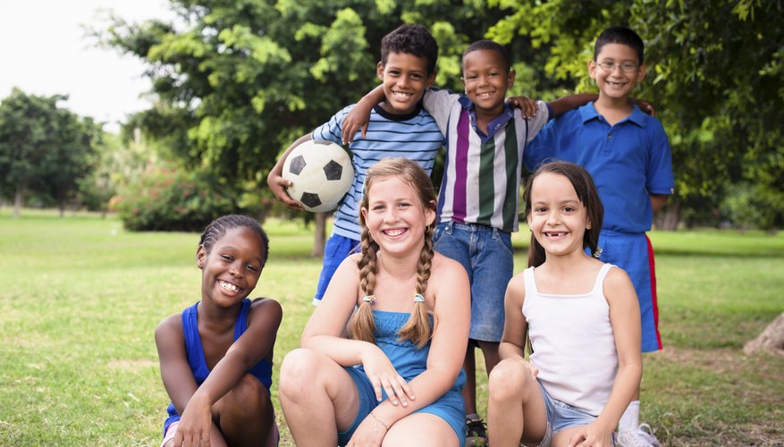 A group of young soccer players pose for a photo. A group of young soccer players pose for a photo.