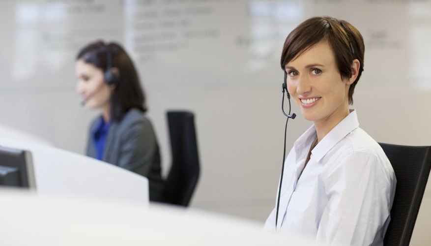 Photo Credit: Robert Daly/OJO Images/Getty Images Smiling salespeople on the phone using headsets.