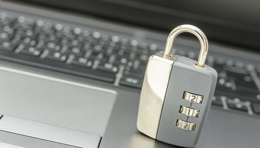 Padlock on laptop keyboard