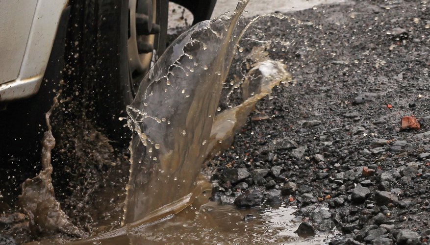 Potholes can damage a car's struts and shock absorbers.