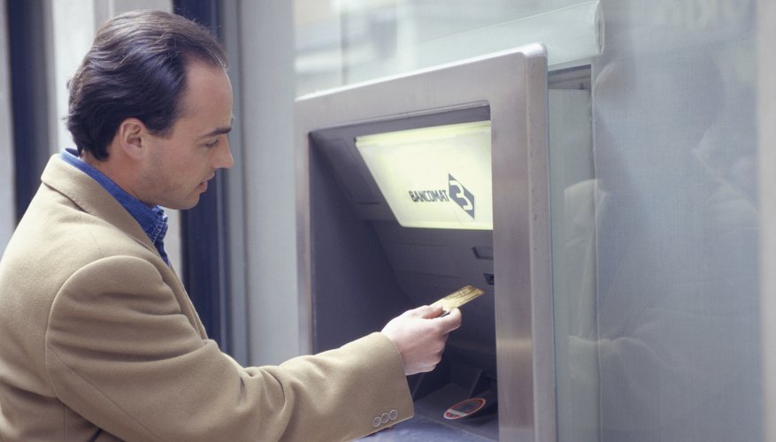 Man at an ATM machine.