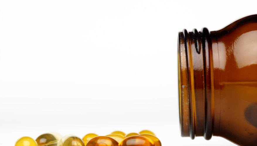 Capsules spilling out of jar. Capsules spilling out of jar.