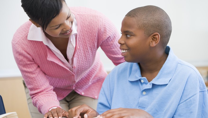 Photo Credit: monkeybusinessimages/iStock/Getty Images Woman helping boy with homework