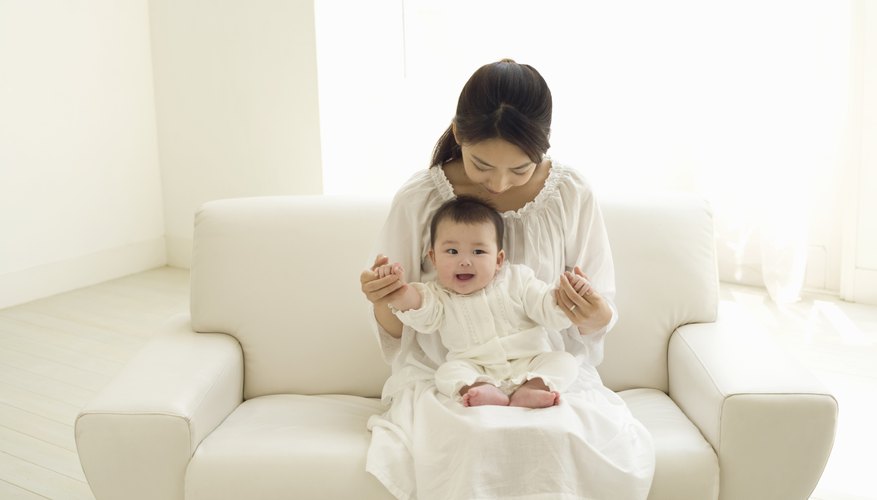 Mother holding young baby Mother holding young baby